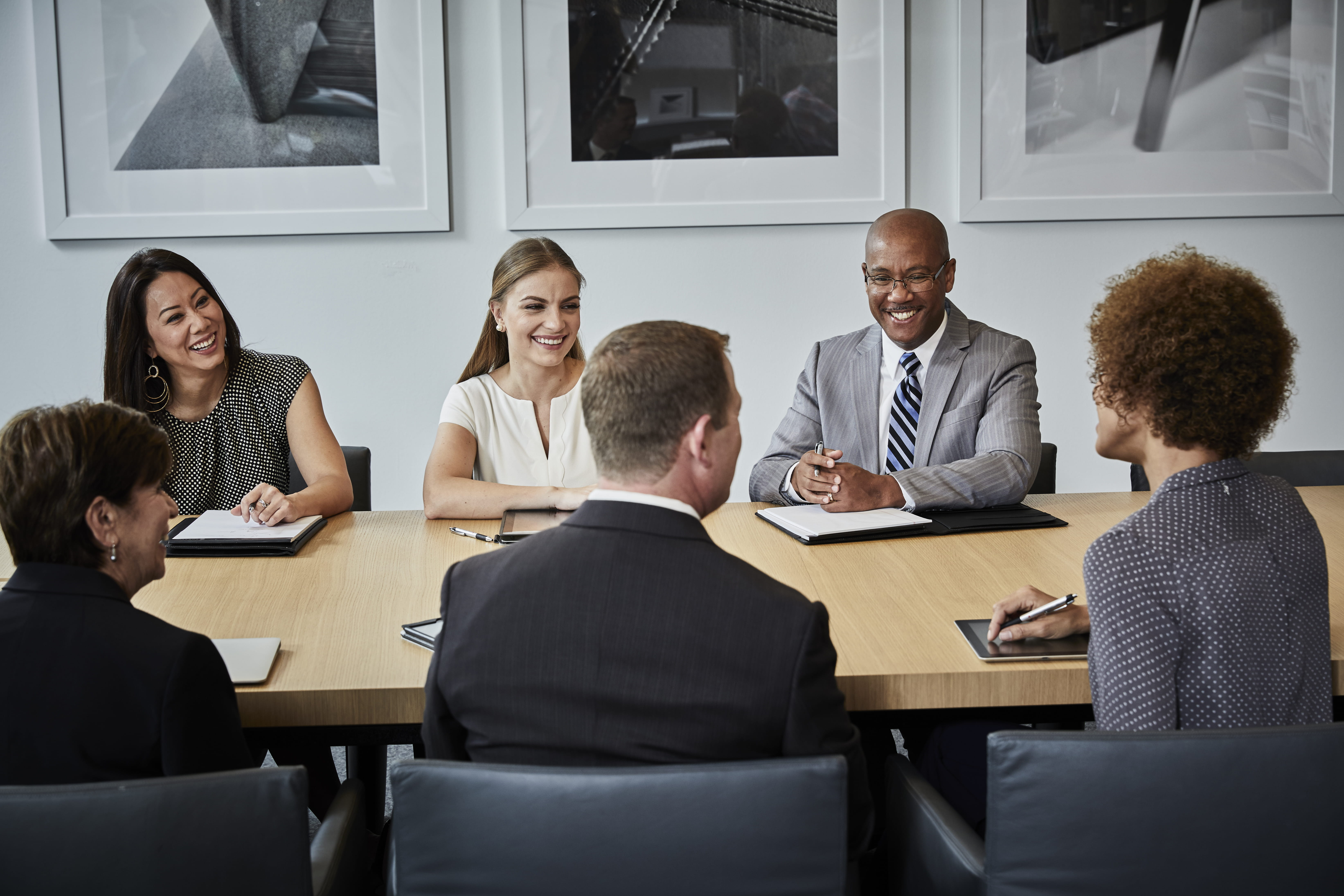 Six people at a conference table